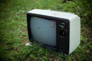 an abandoned TV left outdoors