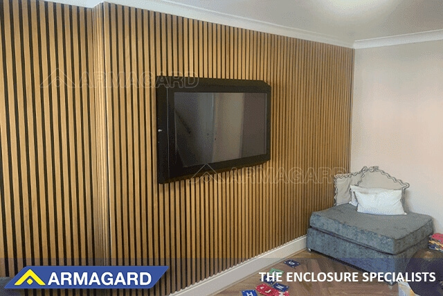 A wall-mounted autism TV protection cabinet in a residential children's home