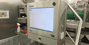 A food processing touch screen enclosure installed in a washdown location