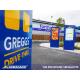Greggs outdoor digital menu displays in a drive thru lane