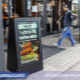 View the interactive sandwich board in use outside a restaurant