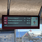 A bar-type outdoor train station digital signage enclosure