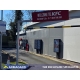 Six KFC digital drive thru menu boards in a drive thru lane