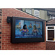 Outdoor TV enclosure wall mount on pub garden