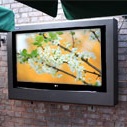 Armagard outdoor tv enclosure mounted on a patio wall