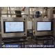 Two 27" PC enclosure systems with extended keyboard drawers within a food manufacturing environment