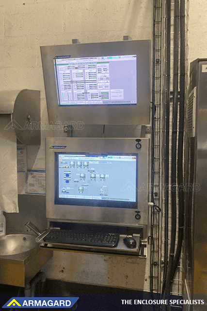 IP66 stainless steel monitor enclosure on busy food production line