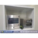 A waterproof touch screen PC and industrial printer enclosure workstation installed in a food production environment