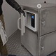 An Armagard operator demonstrates the SPRI-800 heated printer enclosure printing labels in a 30&deg;C environment