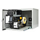An open industrial printer on the sliding shelf of the Armagard Zebra ZT600 dust free printer cabinet