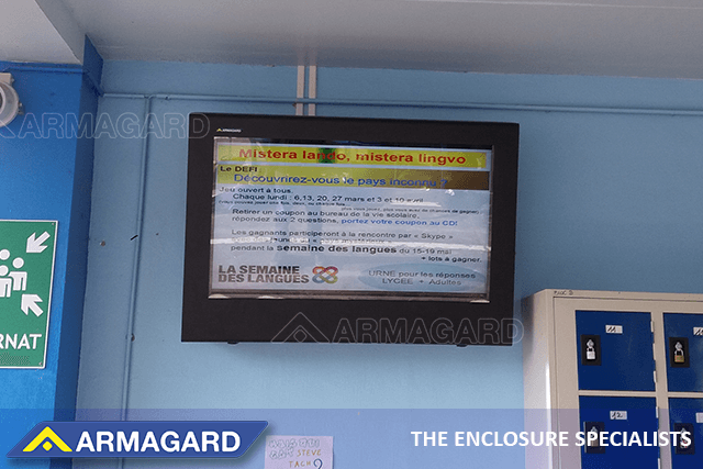 A TV screen for schools and colleges protected by a wall-mounted enclosure
